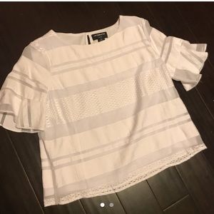 White ruffled sleeve pattern statement shirt